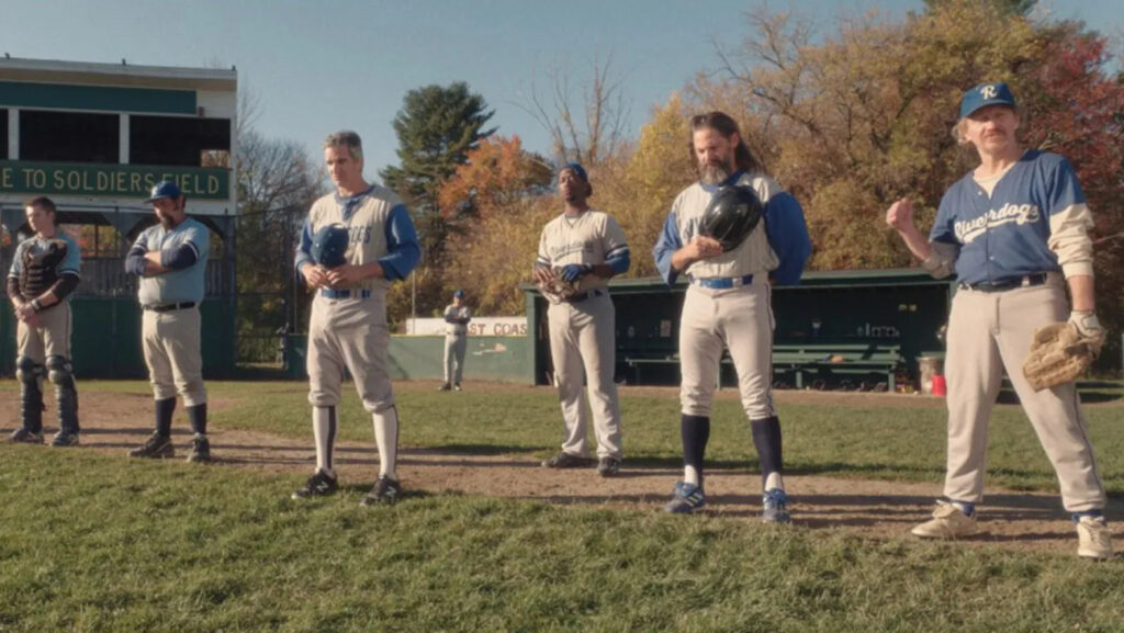 Group of baseball players stand on field. 