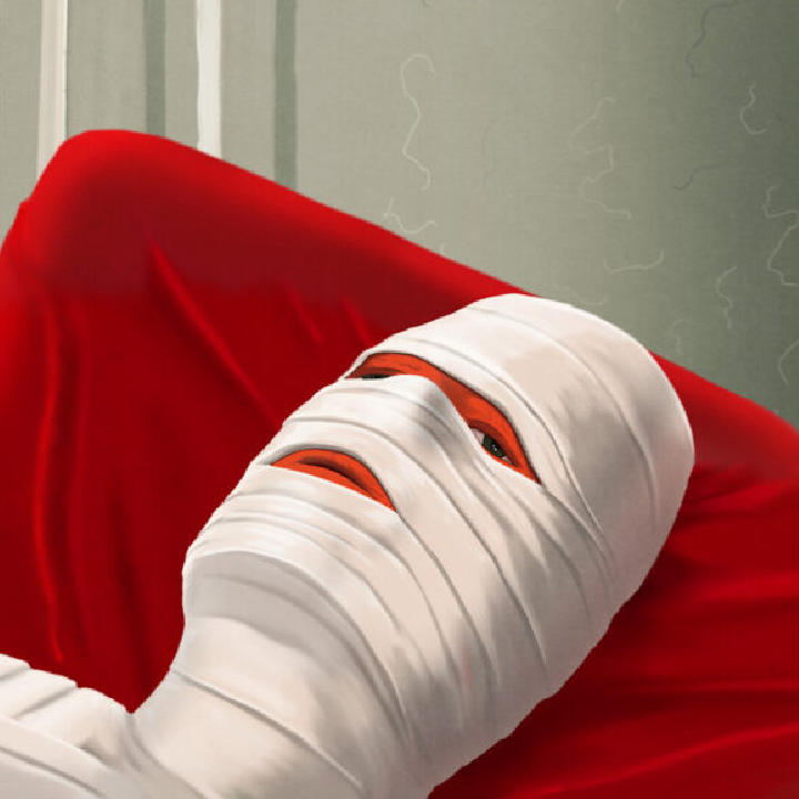 Person wrapped in bandages lays on red cushion